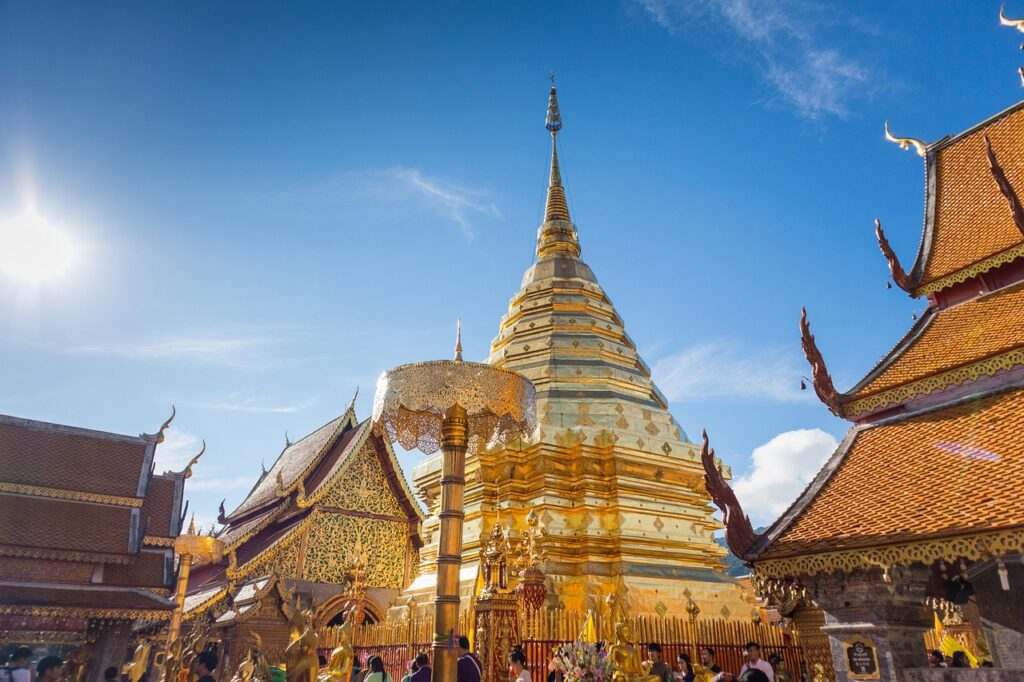 Thailand Travel Itinerary 10 Days A golden temple in Chiang Mai with a clear blue sky.