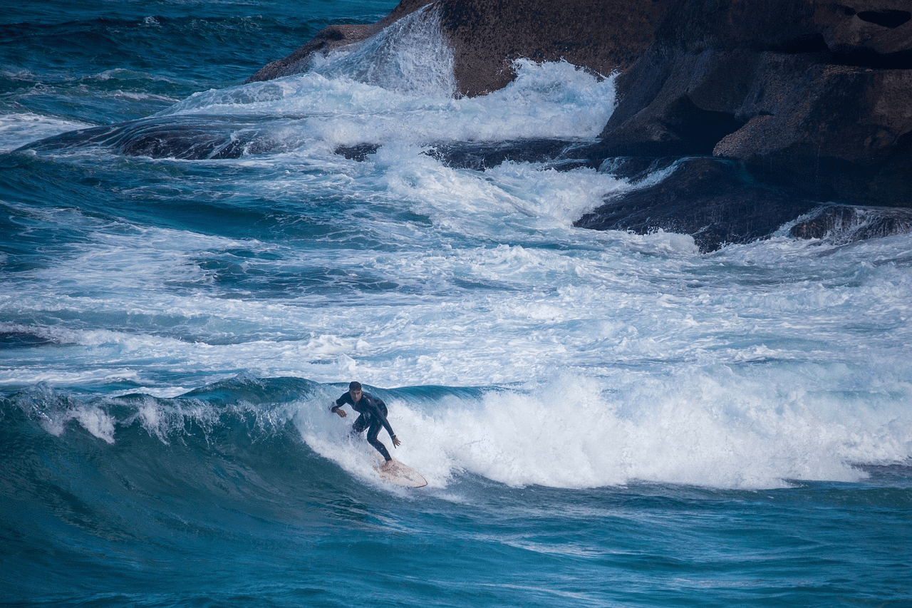 A man surfing. costa rica cheap travel