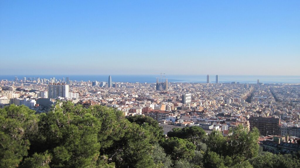 Spring in Barcelona with trees in bloom and sunny outdoor cafés